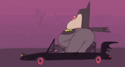 a cartoon batman is sitting in the back seat of a car