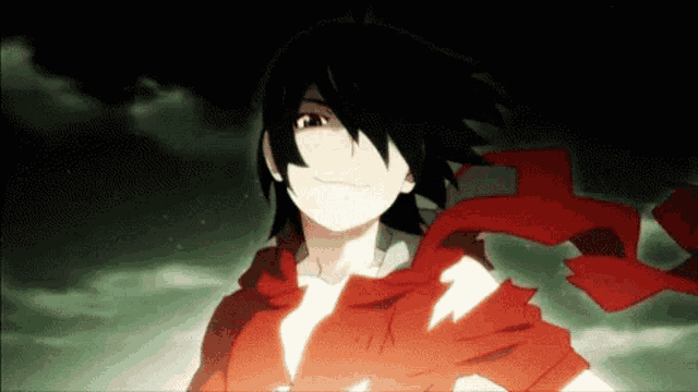 a man with a red scarf around his neck is smiling