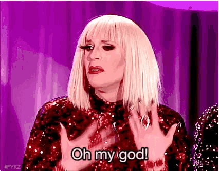 a drag queen is wearing a red sequined dress and making a funny face .