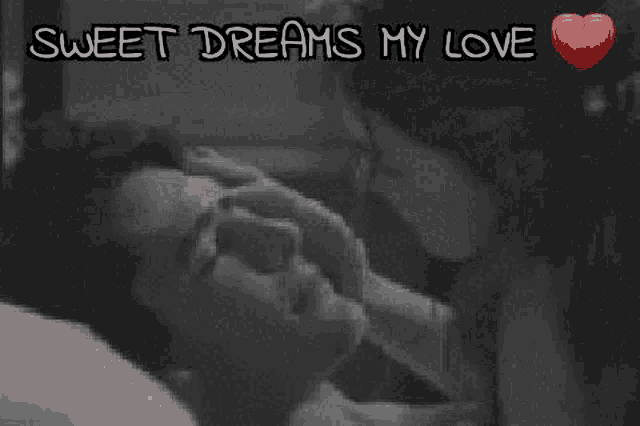 a black and white photo of two people kissing with the words sweet dreams my love above them .