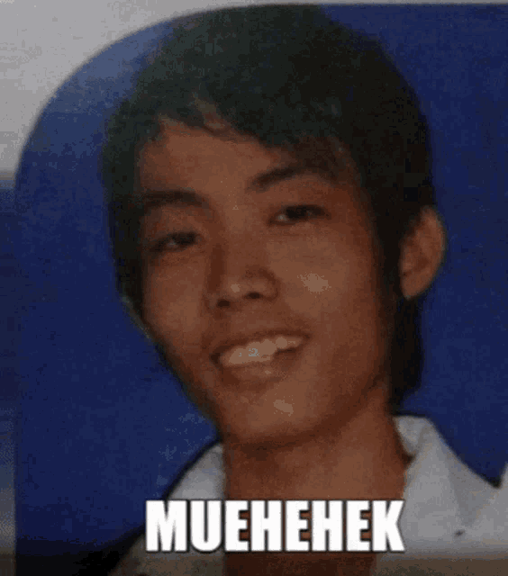 a picture of a young man with the caption muehehek on the bottom