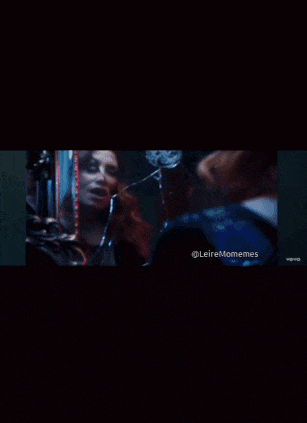 a woman is looking at her reflection in a mirror with the hashtag leiremomemes