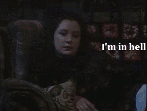 a woman sitting in a chair with the words " i 'm in hell " written above her