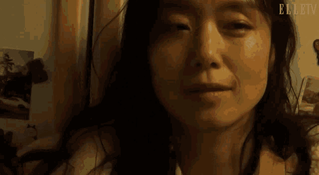 a close up of a woman 's face with elletv written on the bottom right