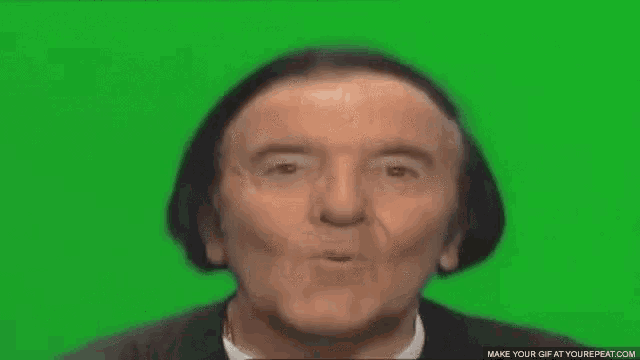 a man with a surprised look on his face on a green screen