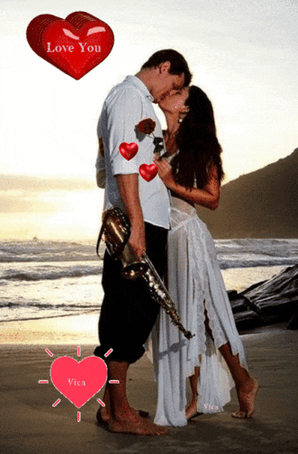 a man holding a saxophone kisses a woman on a beach