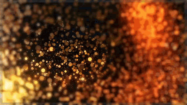a blurred image of a fire with a lot of sparks coming out of it