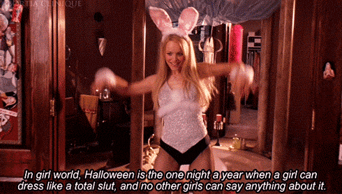 a woman in a bunny costume is standing in front of a mirror with the words in girl world