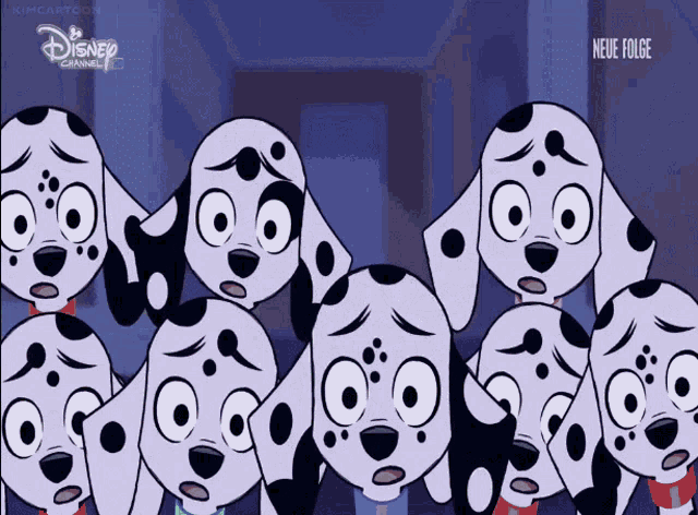 a group of dalmatian dogs are standing in front of a disney channel advertisement