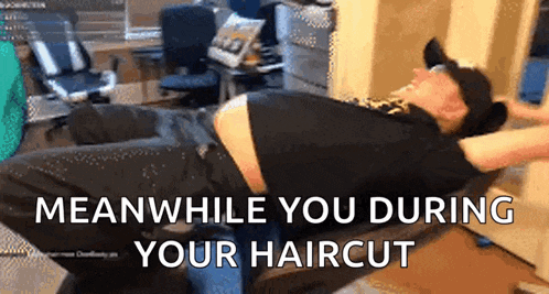 a man is laying on the floor with the words meanwhile you during your haircut written above him