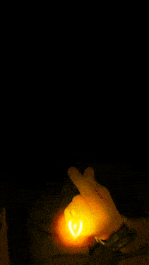 a man in a black shirt is making a funny face with his fingers