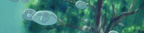 a group of jellyfish floating in the water near a tree .