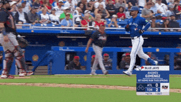 blue jays player andres gimenez is running on the field during a baseball game