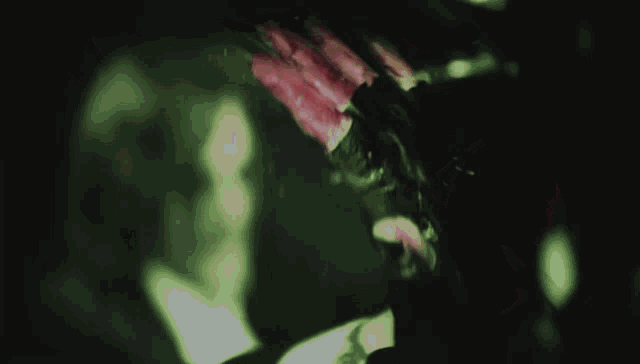 a person 's hands are covered in blood with a pentagram drawn on them