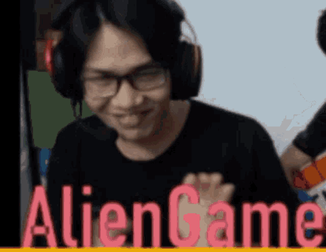 a man wearing headphones and glasses is smiling in a video game .