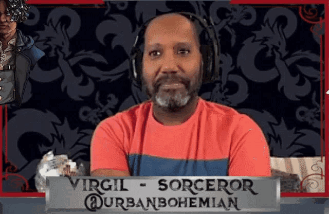 a man with a beard and headphones is sitting in front of a sign that says virgil sorceror urbanbohemian .