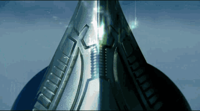 a close up of a metal object with a light shining through it