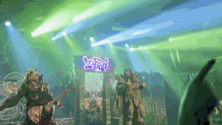 a group of people on a stage with a sign that says scorpions on it