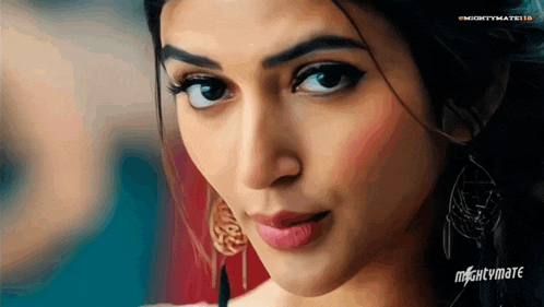 a close up of a woman 's face with mightvmate written on the bottom right