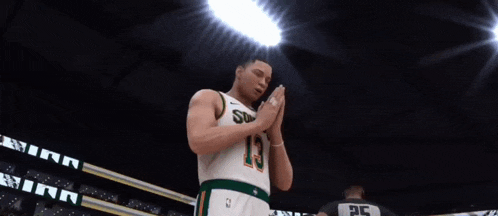 a man in a sonics jersey stands in front of a crowd