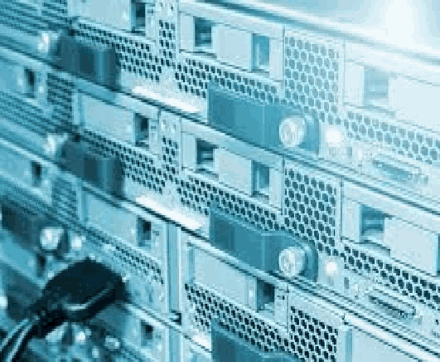 a row of servers sitting next to each other in a data center .