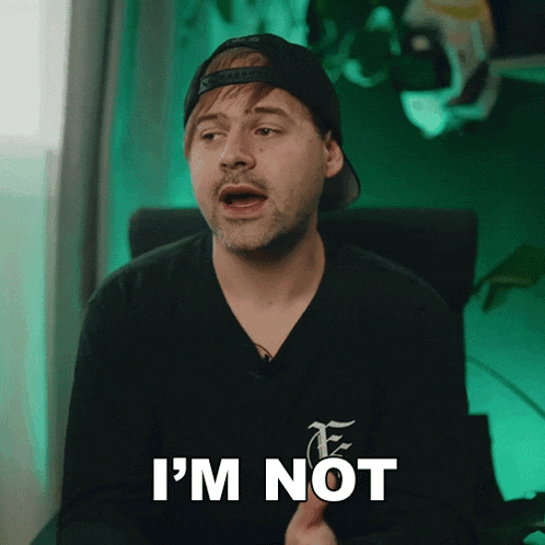 a man in a hat says i 'm not while wearing a black shirt
