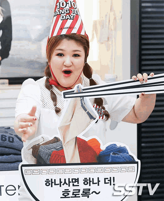 a woman wearing a red and white hat that says jojo hang it day