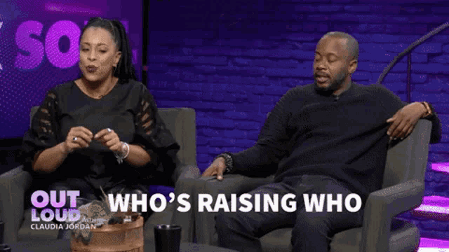 a man and a woman are sitting on a couch and the man is saying " who 's raising who "