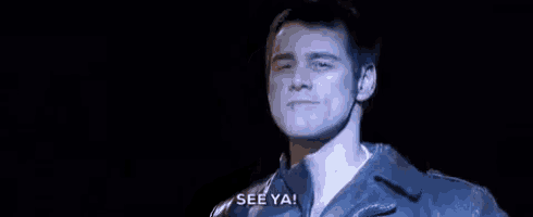 a man in a leather jacket is singing on a stage and saying `` see ya ! ''