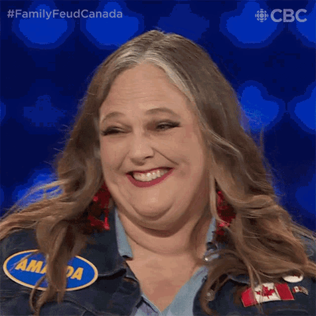 a woman wearing a denim jacket with a name tag that says amanda