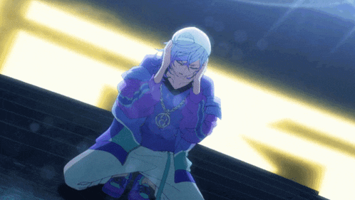 a person wearing a purple sweater and a necklace with the letter g on it