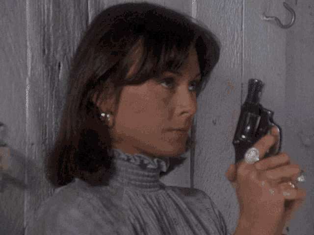 a blurry picture of a woman 's face with a hook on the wall