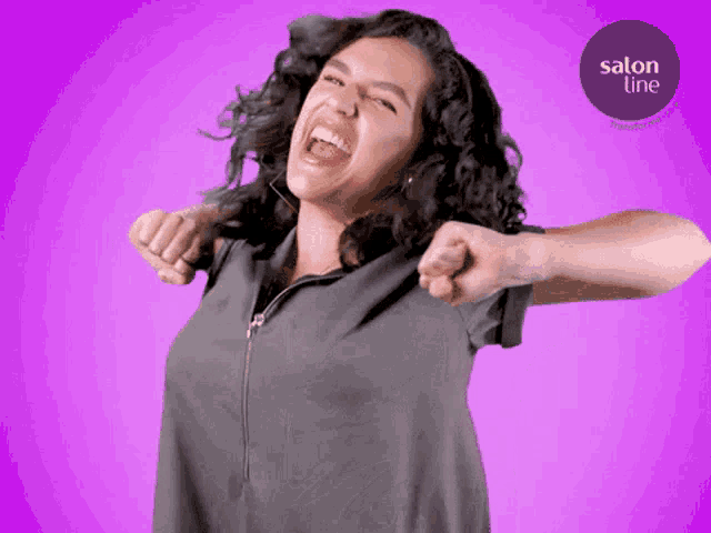a woman is laughing in front of a purple background with a salon line logo