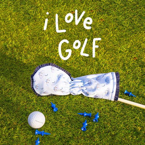 a golf ball and tees are on the grass with the words i love golf written in white