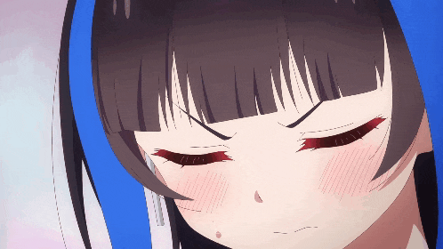 a close up of a girl 's face with her eyes closed and red cheeks