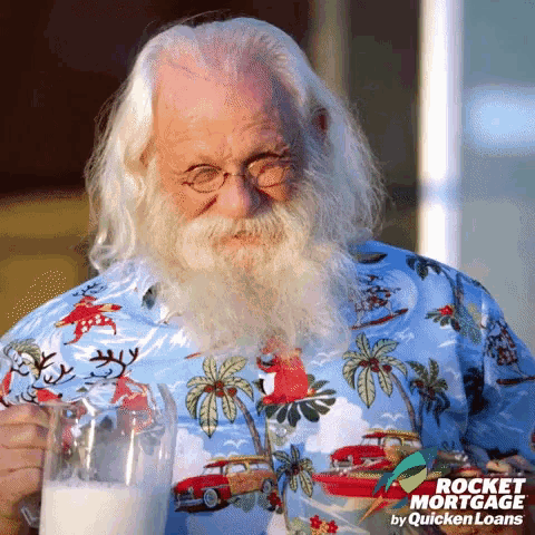 a man with long white hair and a beard is holding a glass of milk