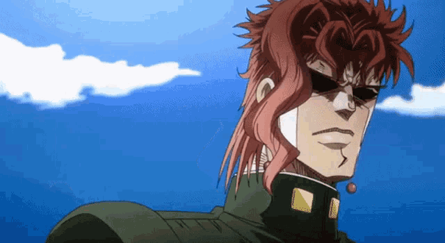 a man with red hair is wearing sunglasses and a green shirt