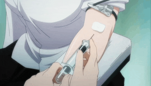 a person is getting a needle in their arm
