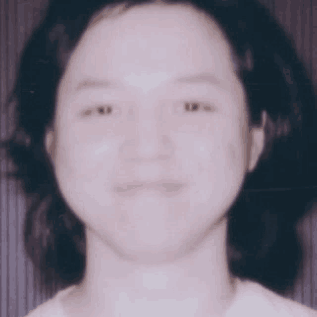 a close up of a woman 's face without a smile
