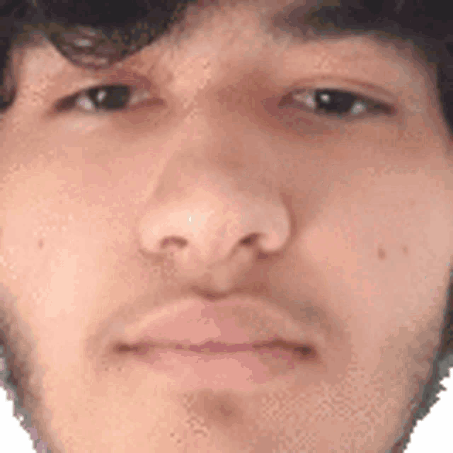 a close up of a man 's face with his eyes closed