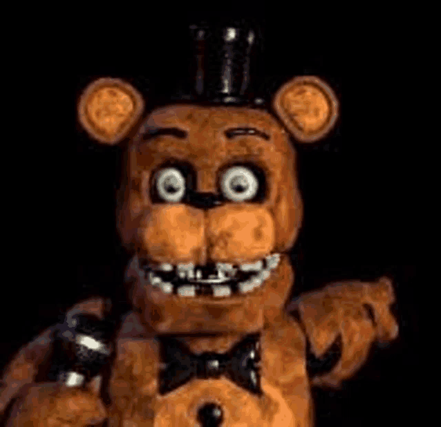 freddy fazbear from five nights at freddy 's is wearing a top hat and holding a microphone .