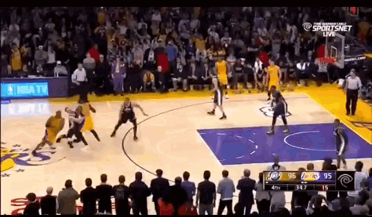 a basketball game is being played in front of a crowd and the score is 95 to 95