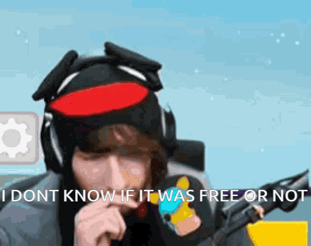 a man wearing headphones and a hat says " i dont know if it was free or no "