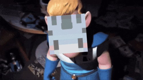 a cartoon character with a pixelated face on his head