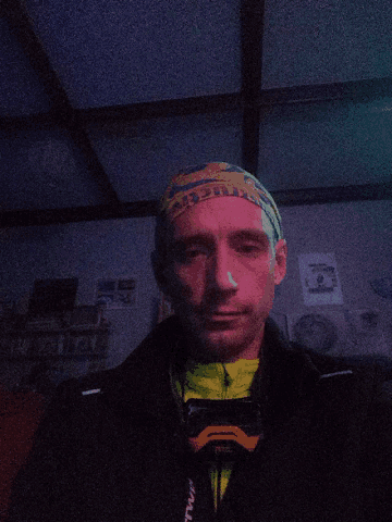 a man is wearing a headband that says ' altitude ' on it