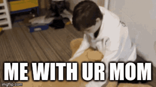 a boy is sitting on the floor with the words me with ur mom written on the bottom