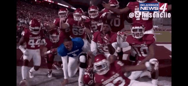a group of football players with the number 69 on their shirts