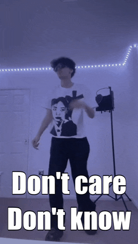 a man in a t-shirt that says ' don 't care ' on it