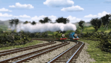 a blue train is going down the tracks next to another train