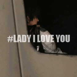 a woman is sitting in a car with the words lady i love you behind her